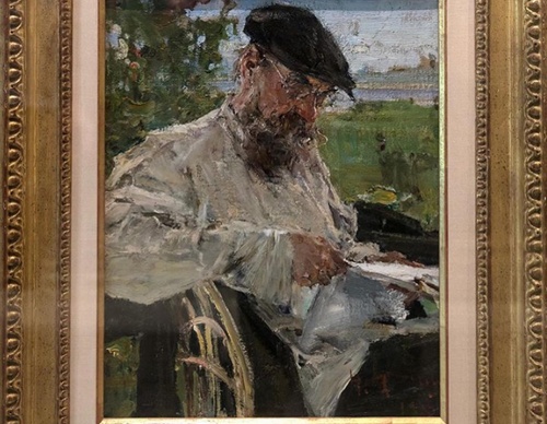 a portrait of the artists father reading by nicolai fechin