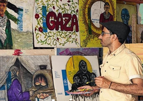 Palestinian Artist Exhibits Works Painted on Gaza Aid Boxes
