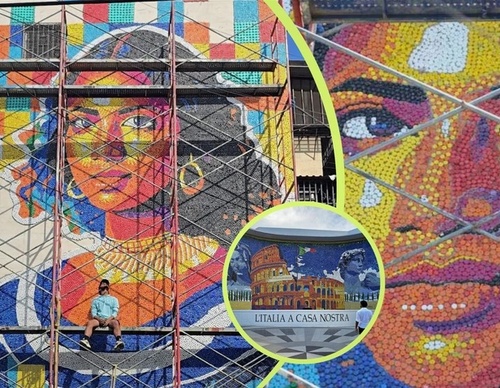 Oscar Olivares Sets Record with Giant Recycled Bottle Cap Mural